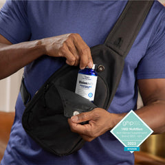 Person taking 1MD VisionMD softgel to support daily eye comfort during device use