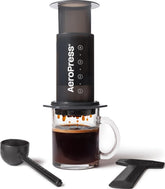 AeroPress Original front view showing compact brewer and accessories for easy brewing