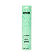 Amika botella frontal 275 ml mostrando diseño y volumen para cuidado reparador