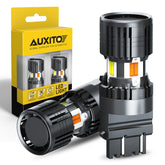 AUXITO bombilla 3157 pack frontal mostrando diseño y doble color más visible