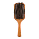 Aveda cepillo pala frontal mostrando superficie amplia y control