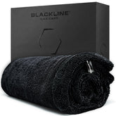 Blackline front view of towel packaging showing product and benefits