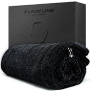 Blackline front view of towel packaging showing product and benefits