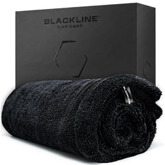 Blackline front view of towel packaging showing product and benefits