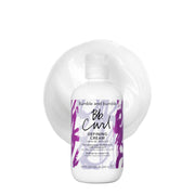 Bumble and bumble envase frontal que muestra la crema para rizos y su acabado profesional