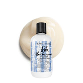 Bumble and bumble envase frontal mostrando el acondicionador y su beneficio volumizante