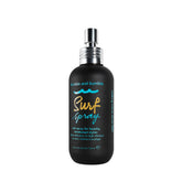 Bumble and bumble envase frontal mostrando el spray y beneficio de textura inmediata