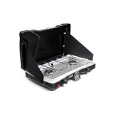 Coleman Triton+ vista frontal abierta mostrando dos quemadores y encendido Instastart