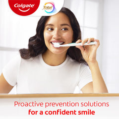 Colgate Total tubo junto a una regla para comparar tamaño y duración