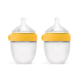 Comotomo botella frontal amarilla mostrando diseño y doble pack beneficios