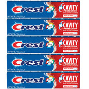 Crest tubo frente mostrando marca y tamaño 8.2 oz, protección anticaries