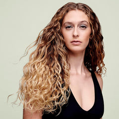 DevaCurl cream texture close-up showing rich hydrating consistency