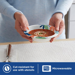Hand holding Dixie bowl with dessert illustrating portion use