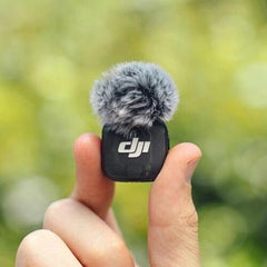DJI Mic 3 charging case open displaying organized slots and portable recharging benefit