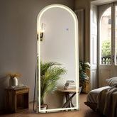 DUMOS arched mirror front view showing elegant silhouette and clear reflection benefit