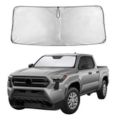 EcoNour parasol frontal instalado en Toyota Tacoma que mantiene interior más fresco