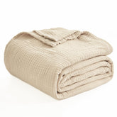 EMME front view of beige throw blanket showing clean styling and safe packaging