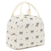 EurCross vista frontal del bolso crema con lazo, elegante y práctico