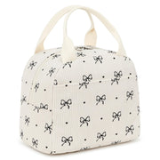 EurCross vista frontal del bolso crema con lazo, elegante y práctico