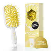 FHI Heat cepillo frontal mostrando forma compacta y ligera para comodidad