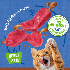 Friskies pouring tuna pate and gravy into bowl showing easy serving and saucy texture