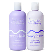 Function of Beauty set frontal mostrando botellas y beneficio antifrizz