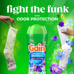 Gain botella en mano para comparar tamaño y facilidad de manejo