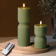 Girimax front view of two olive green pillar candles showing realistic wax finish and color benefit