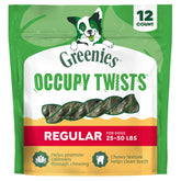 Greenies empaque frontal mostrando Occupy Twists y beneficio limpieza dental