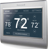 Honeywell Home thermostat front touchscreen showing customizable color and clear controls, improving usability