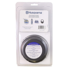 Husqvarna T35 spool close-up with arrows and key slots, reduces tangling benefit