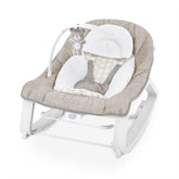Ingenuity Keep Cozy front view showing comfortable seat and neutral Linden finish