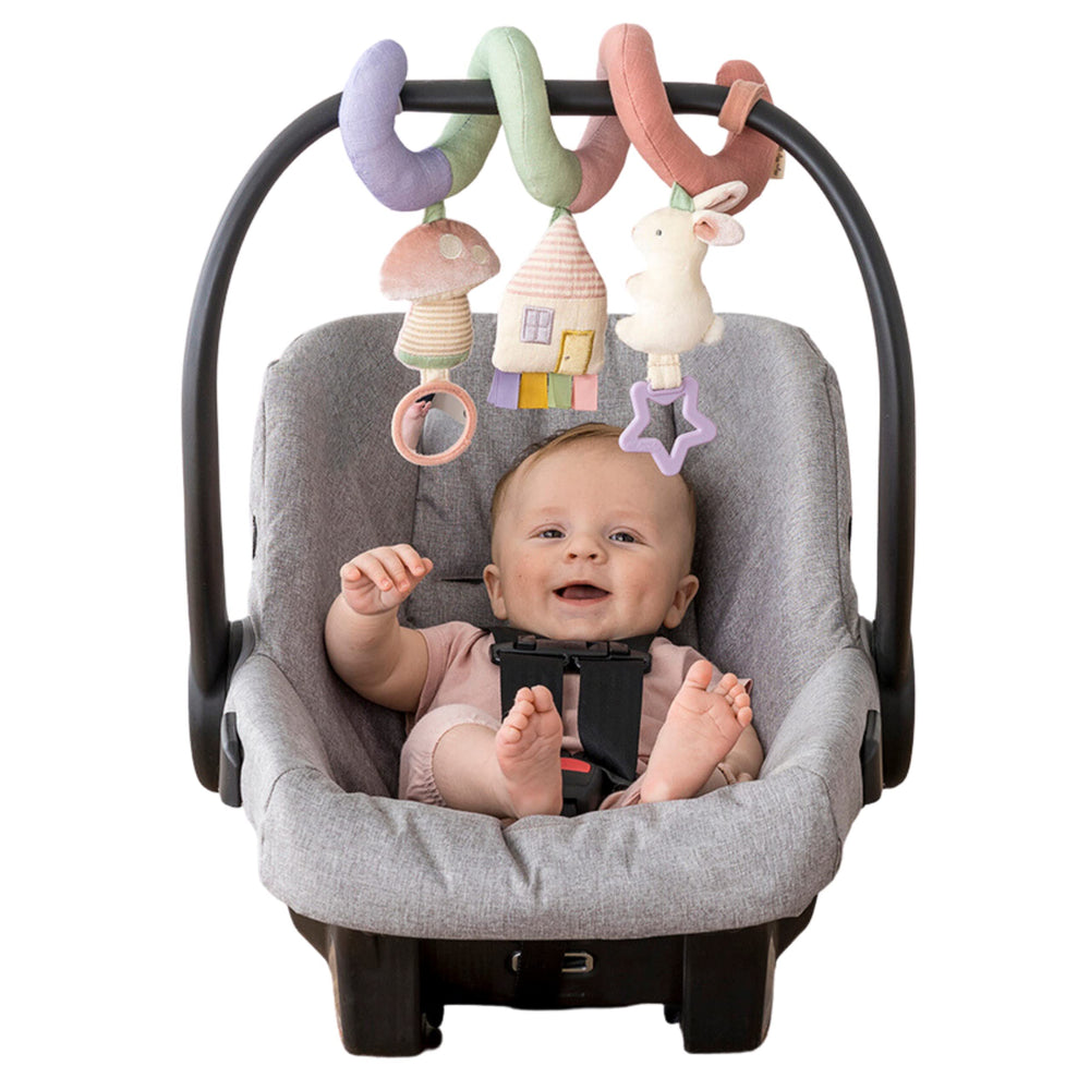 Itzy Ritzy spiral front view showing pastel rainbow and soft toys for travel