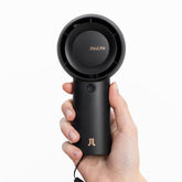 JISULIFE front view of black handheld fan showing compact design and strong airflow benefit