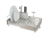 Joseph Joseph front view of extendable steel dish rack showing compact design and stainless finish for tidy counters