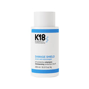 K18 envase frontal del champú mostrando diseño y beneficio protección del color