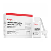 Keeps minoxidil frontal del envase mostrando diseño y tamaño práctico