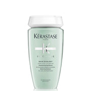 KÉRASTASE botella frontal Bain Divalent mostrando diseño y beneficio de limpieza equilibrada