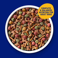 Kibbles 'n Bits 31 lb bag beside a scale showing large bulk size benefit