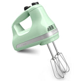 KitchenAid hand mixer front view in white showing controls and ergonomic handle for easy mixing