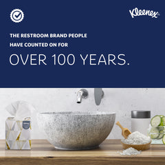 Kleenex caja colocada en dispensador comercial para fácil acceso