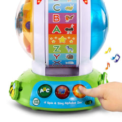 LeapFrog held in an adult hand showing compact size and easy toddler grip for travel