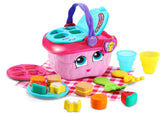 LeapFrog picnic basket front view showing pink design and lights, ready to play