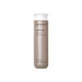 Living Proof frasco frontal mostrando diseño y beneficio anti-frizz