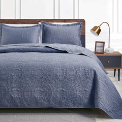 Love's cabin front view quilt showing full queen coverage and modern blue look