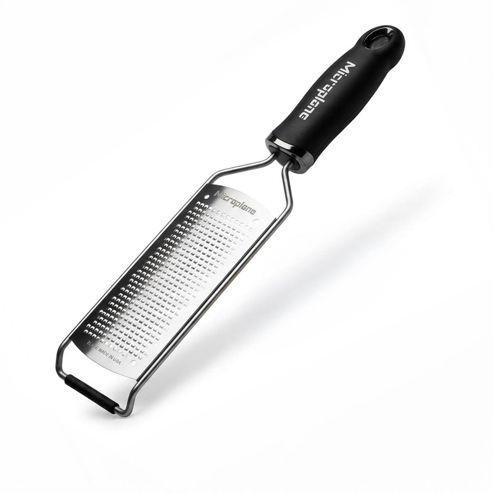 Microplane gourmet fine grater front view showing compact black handle and blade for precise results