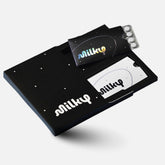 Milky front packaging cosmic black showing sleek compact bottle and brand