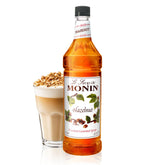 Monin jarabe de avellana botella frontal 1 litro mostrando el diseño y uso profesional