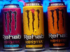 Monster Rehab poured into iced glass lifestyle shot showing refreshment benefit