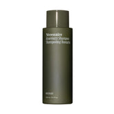 Nécessaire bottle front view showing clean packaging and benefits
